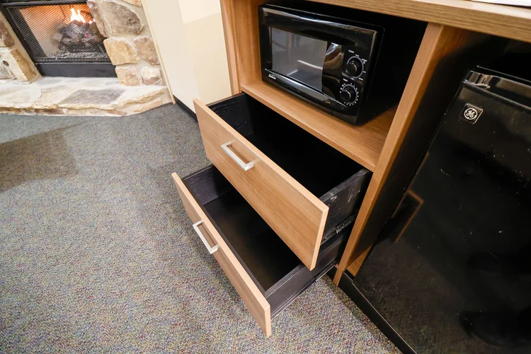 Norma Dan Motel King Room with Fireplace and/or Jacuzzi dresser with microwave and mini fridge