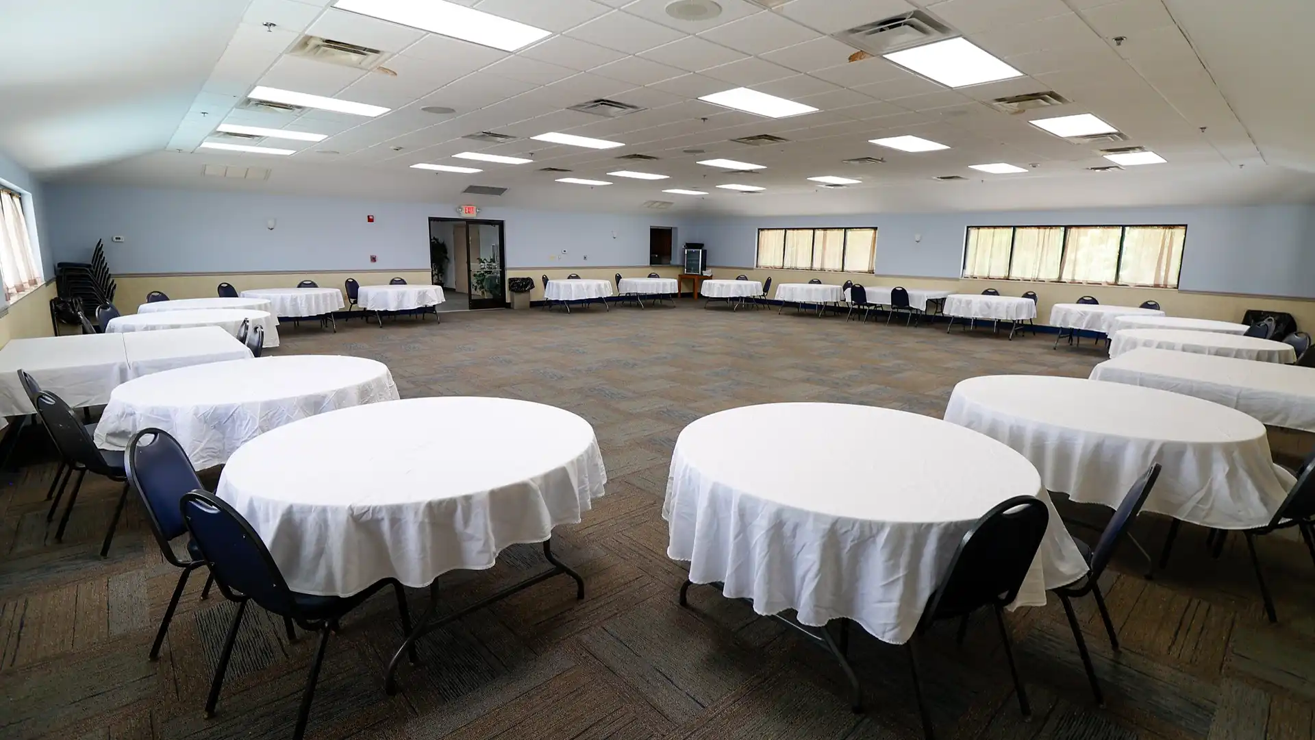 Norma Dan Motel meeting space room with round tables and chairs set up