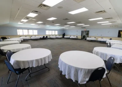 Norma Dan Motel meeting space with round tables and tablecloths