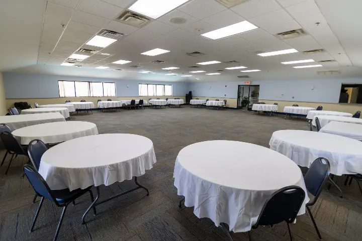 Norma Dan Motel meeting space with round tables and tablecloths