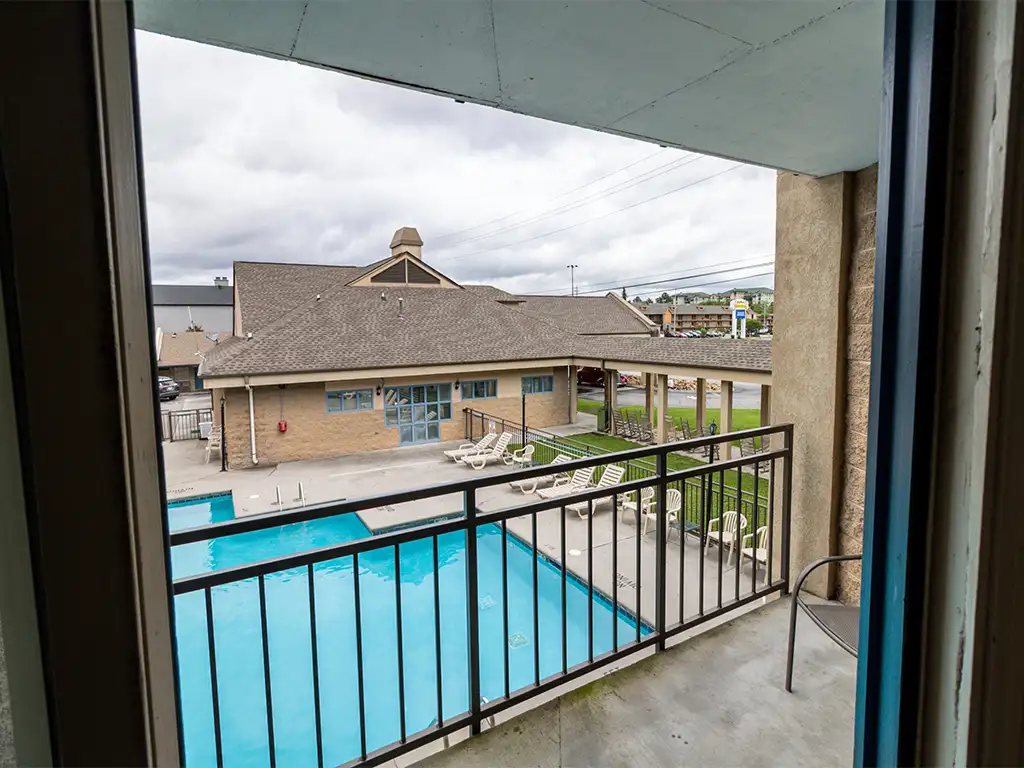patio-bkg-2 Outdoor pool view from a balcony at the Norma Dan Motel
