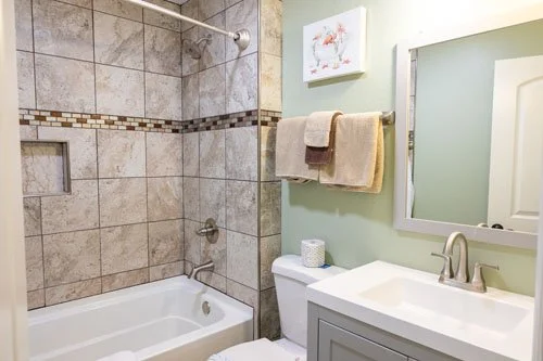 Norma Dan Riverside Cottage bathroom sink,toilet, and shower/tub combo