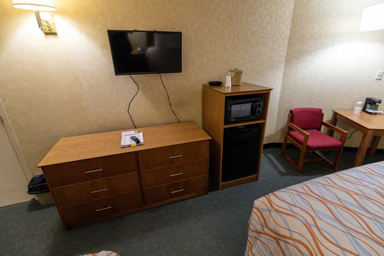 Norma Dan Motel Two Queen Bed Room with dresser, TV, microwave and mini fridge